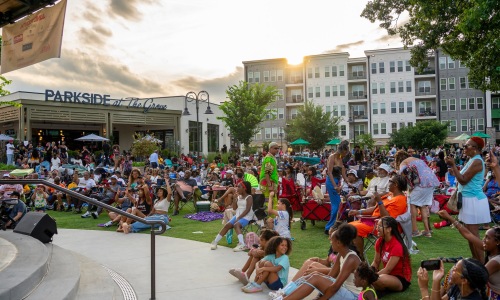 a outdoor area where people are watching a performance