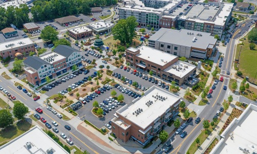 aerial view of buildings and parking lots
