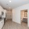spacious kitchen with stainless steel appliances and plank flooring