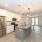 Spacious kitchen with double door fridge and granite kitchen island