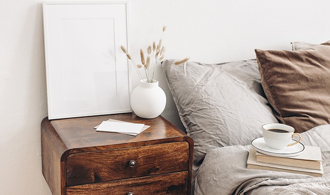 Large well lit bedroom with plush carpet floors and large windows.