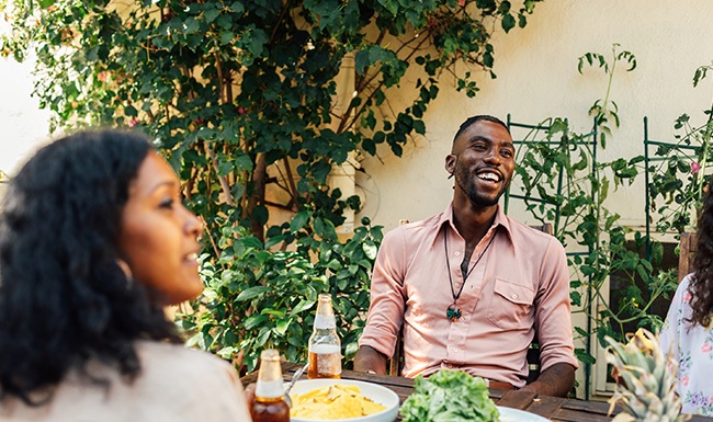 Group of friends hanging out enjoying a meal 