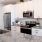 Open kitchen and living room with plenty of natural light.