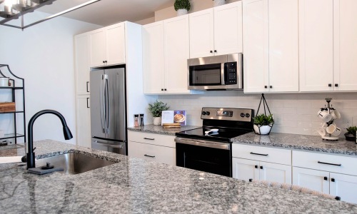 Kitchen Open kitchen and living room with plenty of natural light.